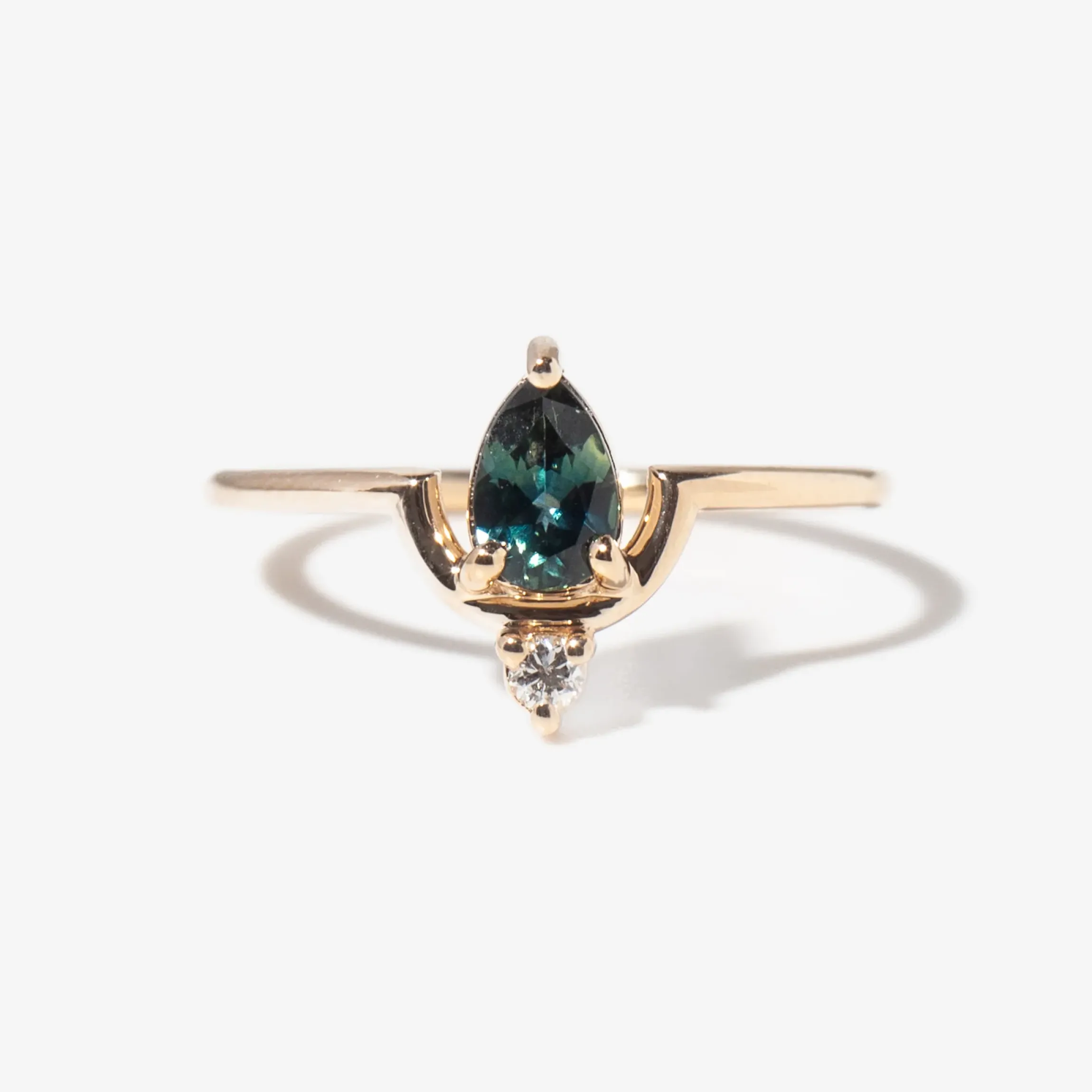 Medium Pear Cut Teal Sapphire and Diamond Nestled Ring