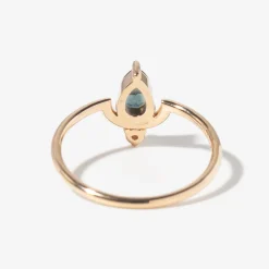 Medium Pear Cut Teal Sapphire and Diamond Nestled Ring