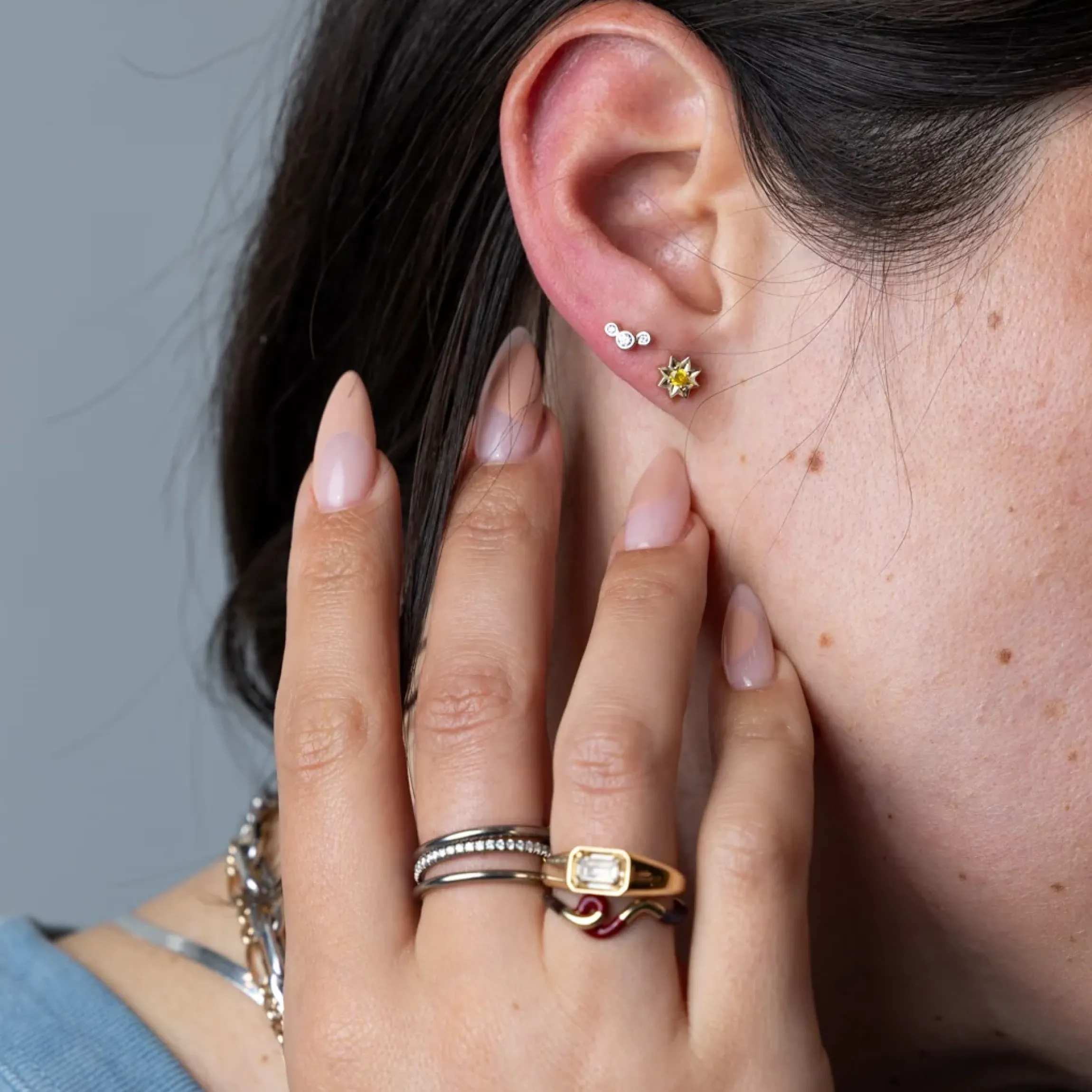 Three Small Graduated Diamond Bezel Studs